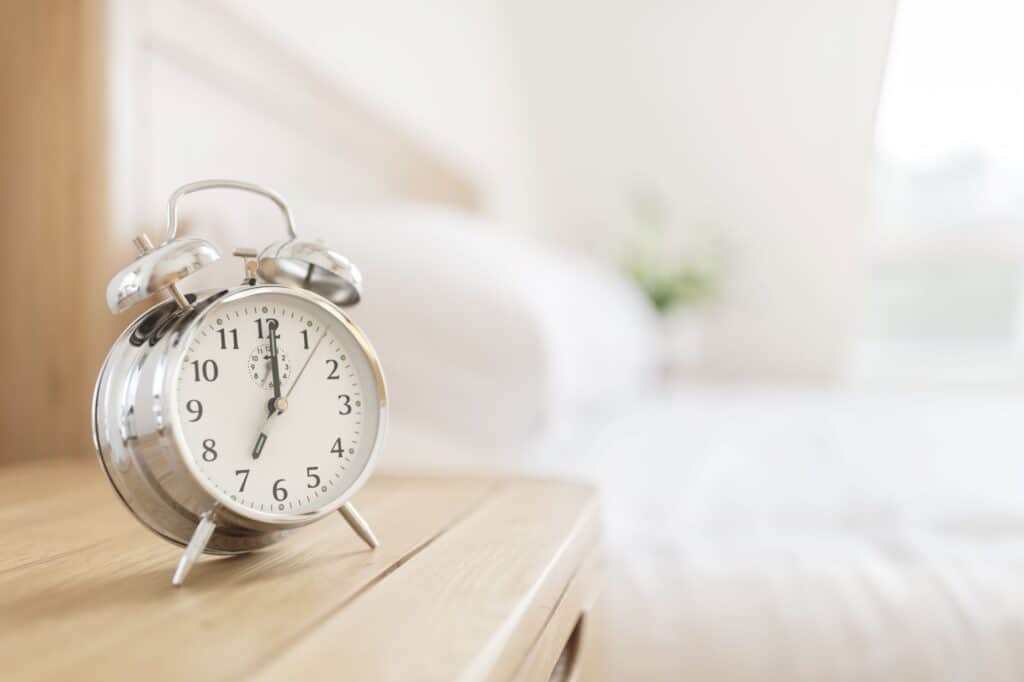 alarm clock on bedside table