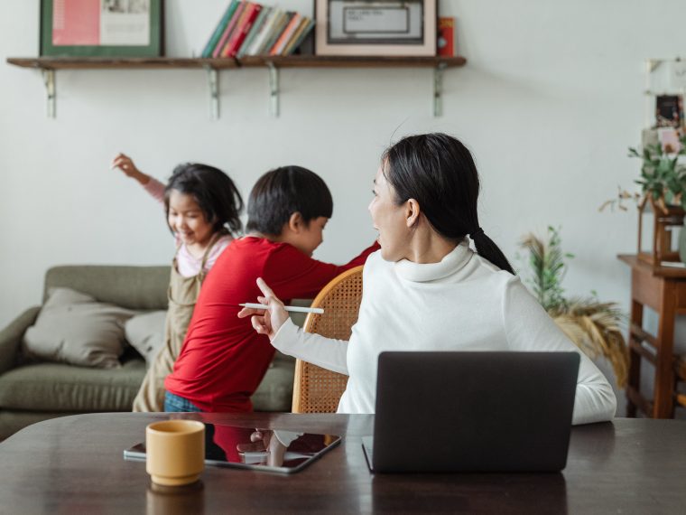 mom working at home disrupted by kids