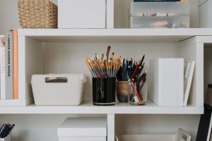 organized shelf with office supplies