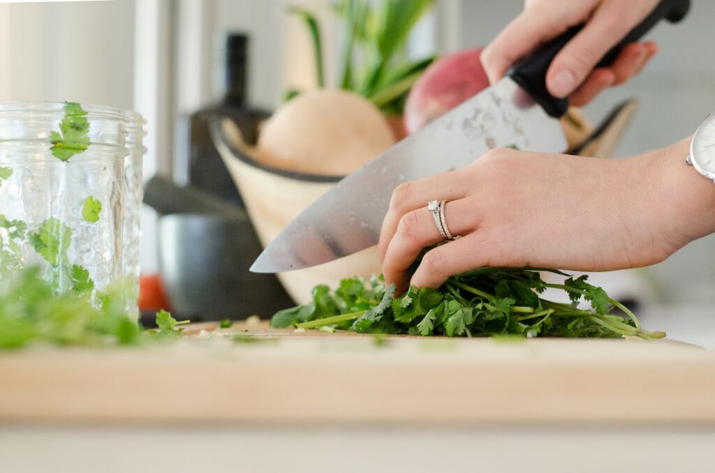 woman chopping vegetables in the kitchen.