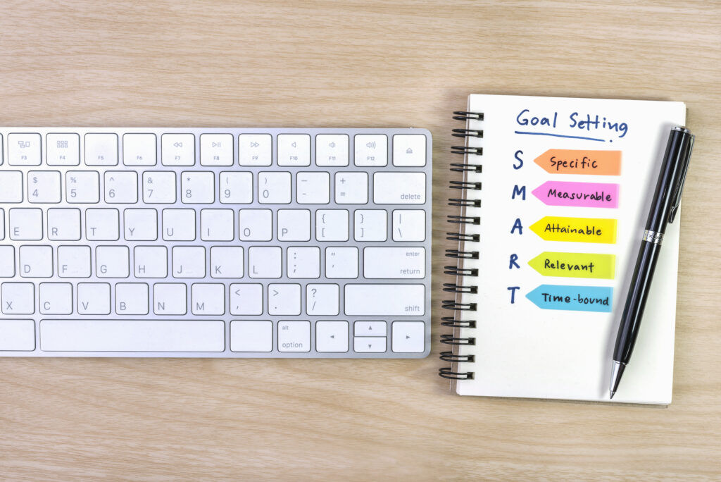 Desk with SMART goals planner.